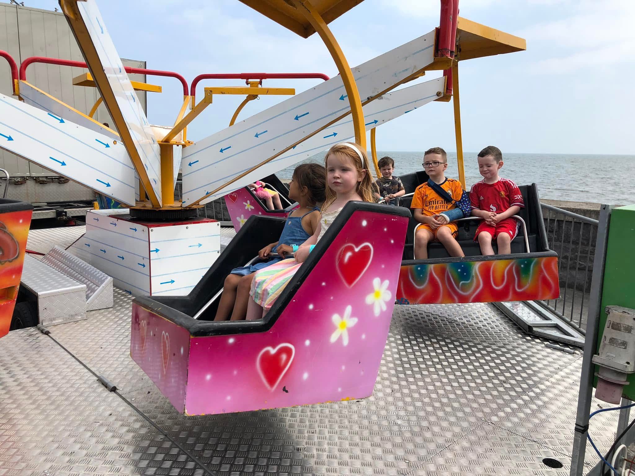 Children enjoying a Freestyle Amusements fairground ride